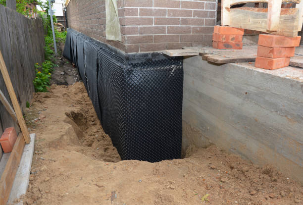 Happy homeowners after waterproofing job in Hydes